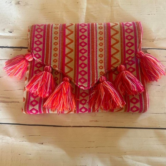 The Unbranded Brand Handbags - Mudpie Pink and orange embroidered geometric patterned clutch with tassels